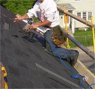 Roofer working with guard rails
