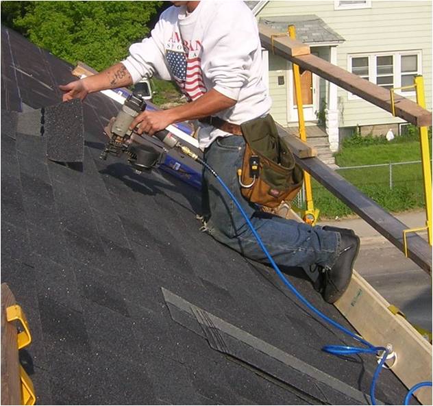 Roofer working with guard rails